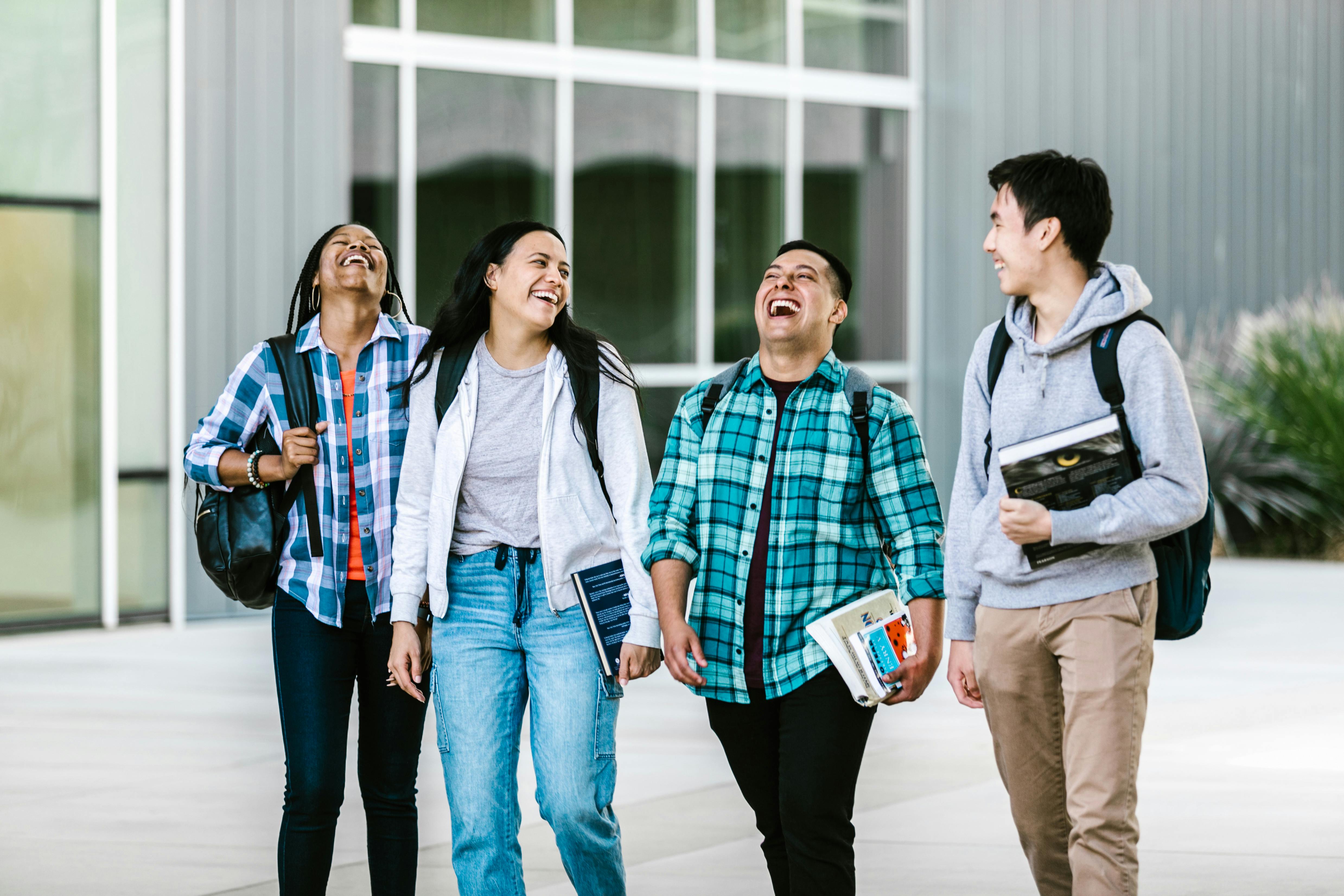 University students walking together outside and talking between classes.